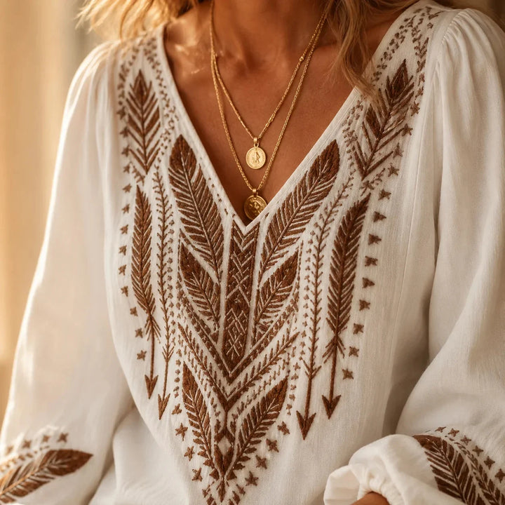 Elegant women's boho embroidered V-neck blouse, a versatile long-sleeve top for any casual occasion.