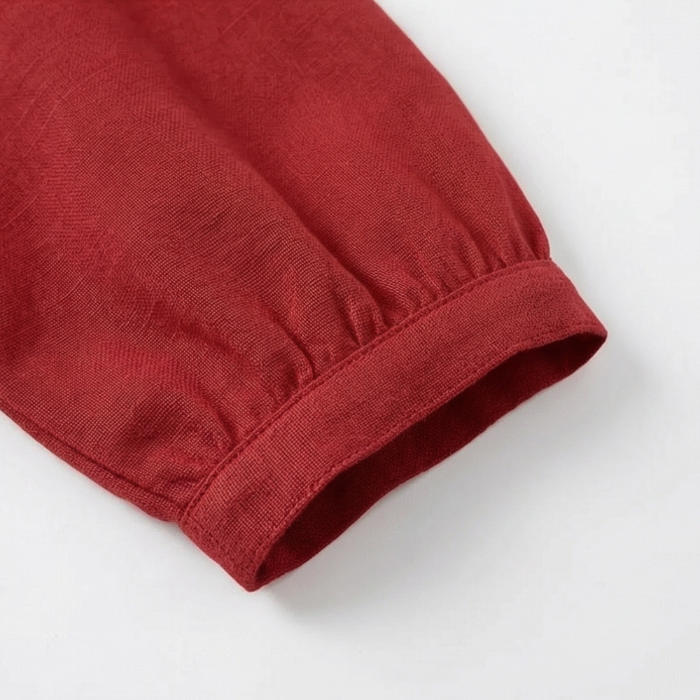 Relaxed fit women's blouse with cute Peter Pan collar & puff sleeve details.