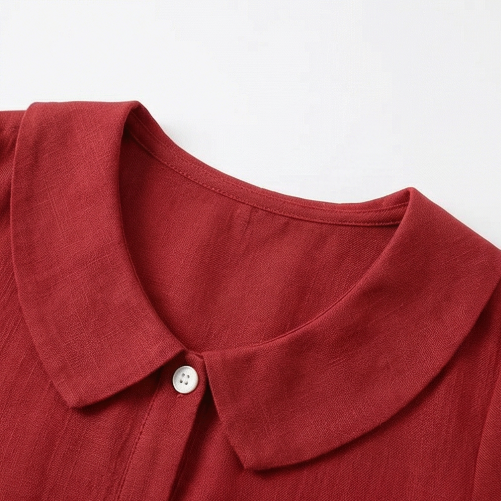 Lightweight women's blouse with a charming Peter Pan collar & subtle puff sleeves.