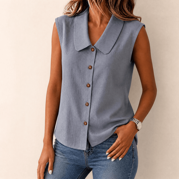 Versatile sleeveless blouse for women, collared, button-up, perfect for layering or solo wear.