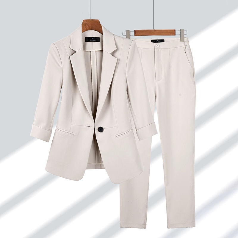 Elegant women's two-piece suit set with a stylish blazer and trousers, perfect for business casual and office wear.