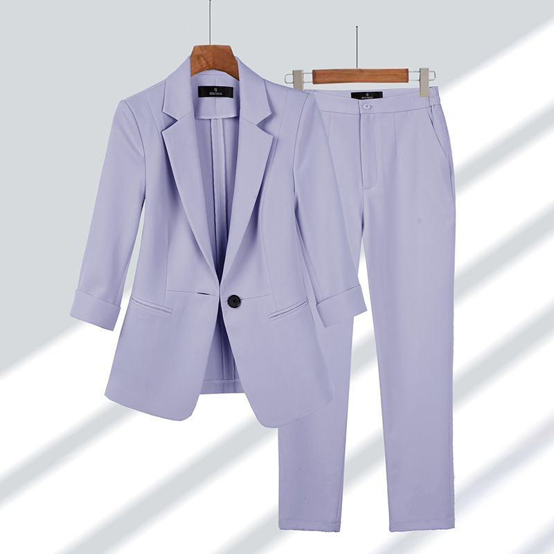 Chic women's two-piece suit set, including a fashionable blazer and tailored trousers, great for workwear and elegant occasions.