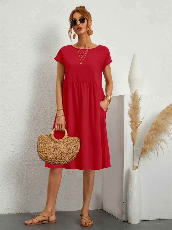 Women's casual A-line midi dress with pockets, perfect for summer comfort and style.