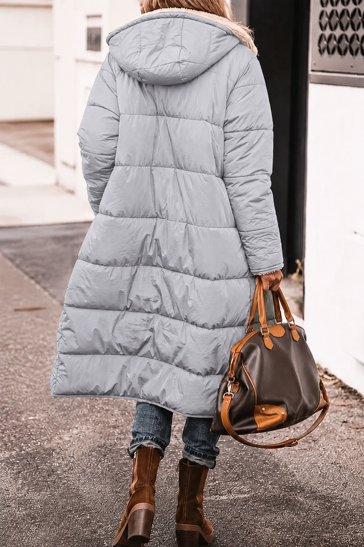 Brown women's reversible winter outerwear with cozy fur, great for cold weather versatility.