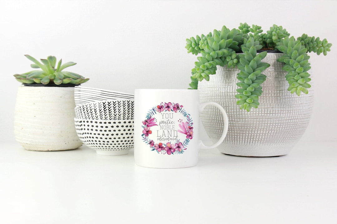 Floral wreath white ceramic mug with inspirational quote, great for coffee, tea, or as a home kitchen gift.