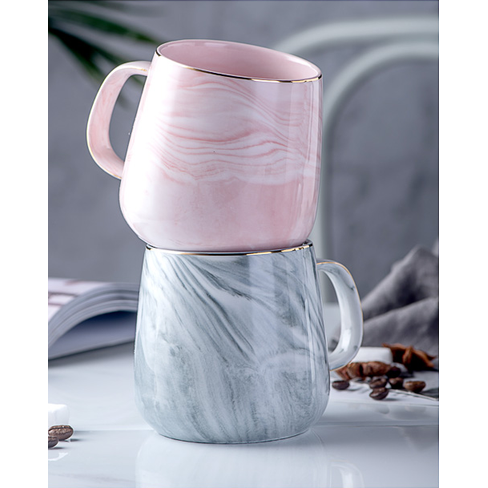 Luxury ceramic coffee cup, elegant white marble design, gold rim. Ideal for stylish tea or coffee breaks.