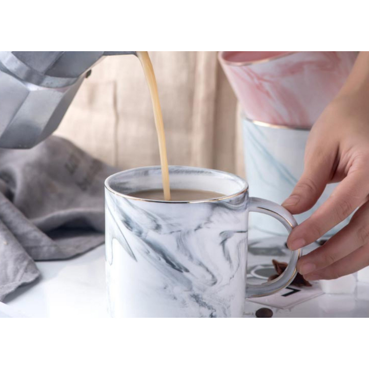 Chic marble ceramic mug, gold rim detail. A perfect elegant gift idea or luxury home decor accent.