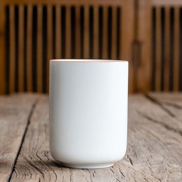 Stylish handleless Japanese ceramic tea mug with distinctive crackle glaze, perfect for any kitchen.