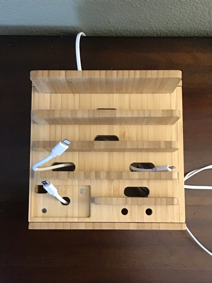 All-in-one bamboo device organizer & 5-port universal charging hub for smartphones, tablets, and other gadgets.