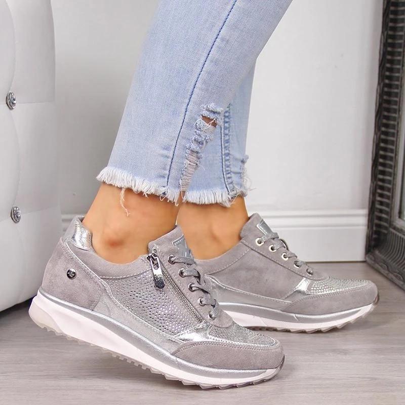 Glamorous women's platform trainers, rhinestone sparkle sneakers featuring zip and lace-up closure. Modern style.