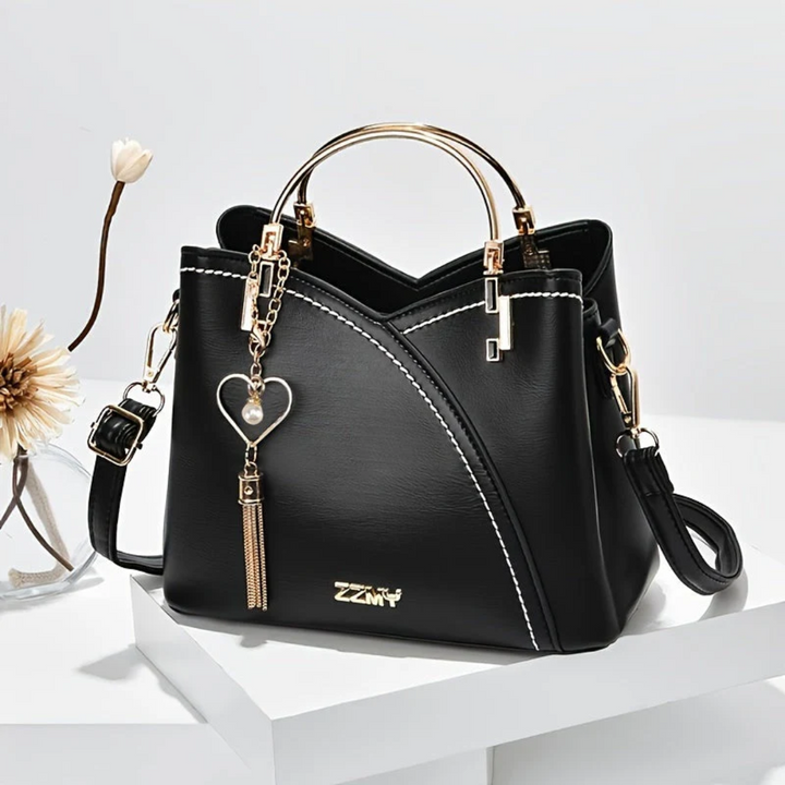 Modern women's faux leather handbag, chic and versatile for all fashion needs.