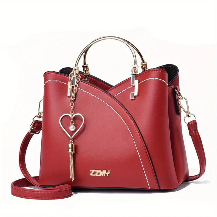 Fashion-forward women's faux leather handbag, an essential elegant accessory.