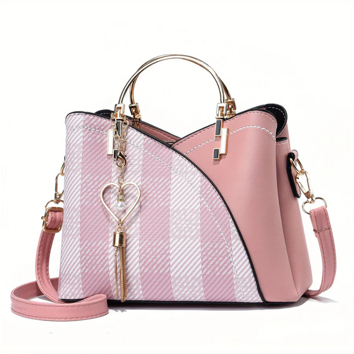 Sleek ladies' faux leather handbag, elegant and fashionable, ideal for evenings.