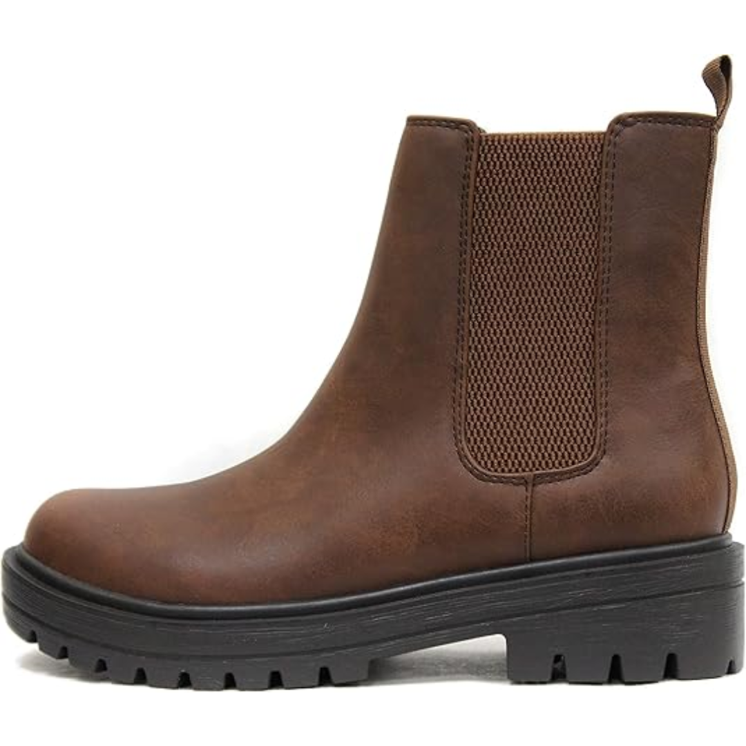 Smooth black faux leather women's Chelsea ankle boots, a versatile and chic option for sophisticated fall fashion.
