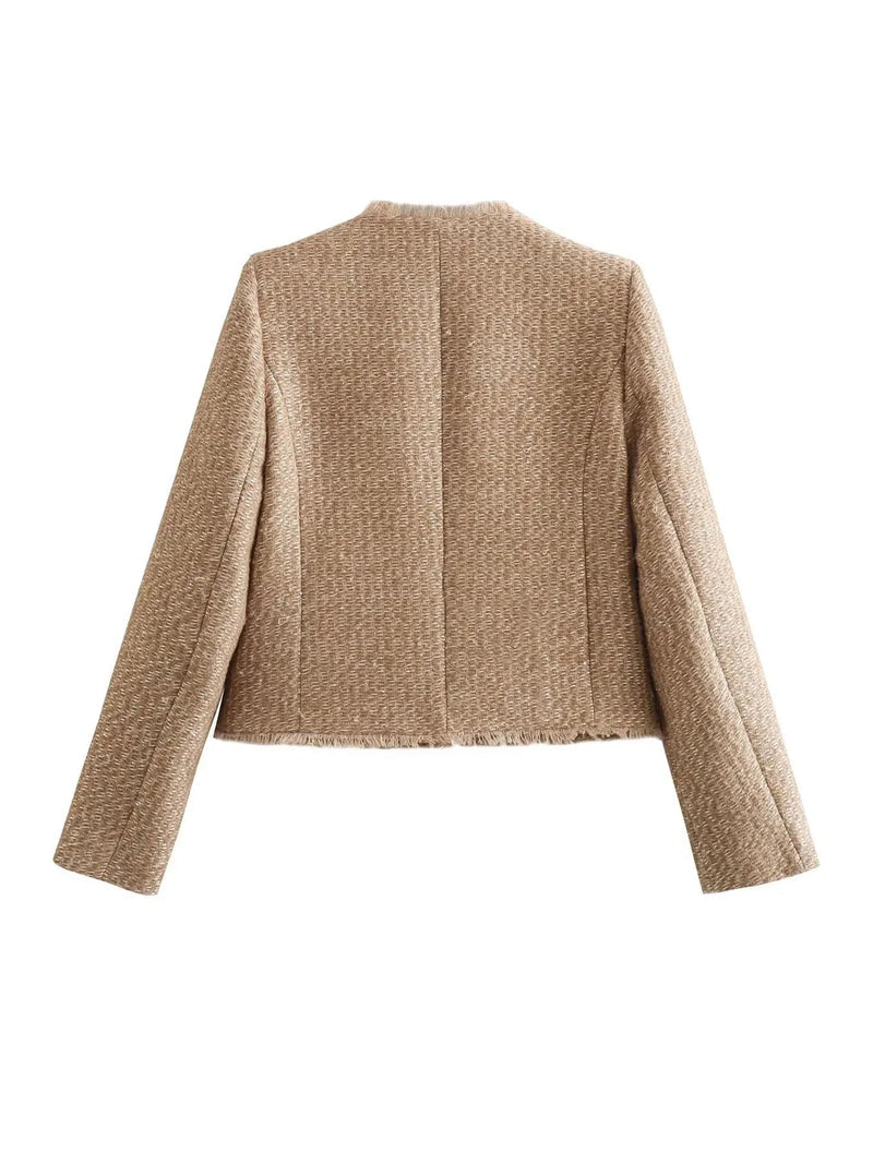 Luxurious beige tweed jacket for women, featuring classic design and striking gold buttons. Elegant style.
