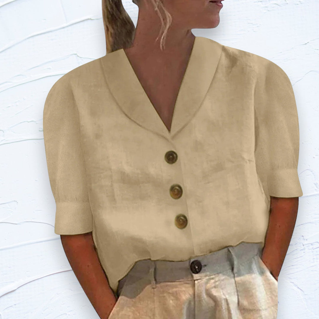 Stylish women's button-up blouse, an elegant collared top suitable for casual or dressy occasions.