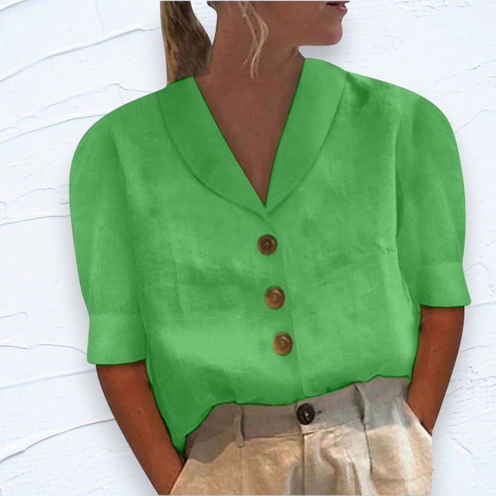 Classic women's collared blouse with V-neck, elegant button-up for a chic & versatile look.