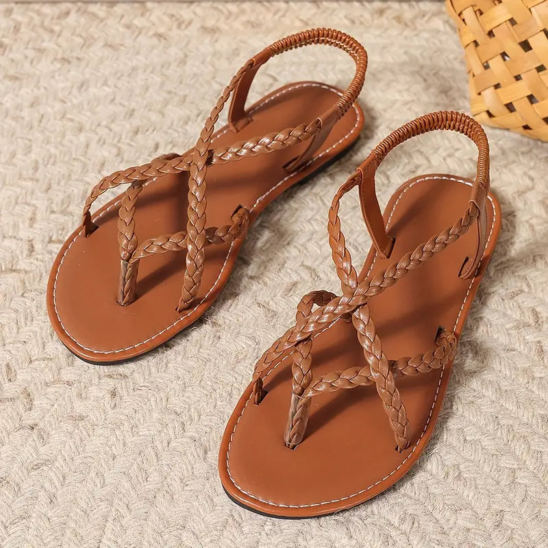 Comfortable women's beach flat sandals: braided strappy style with a secure toe ring.