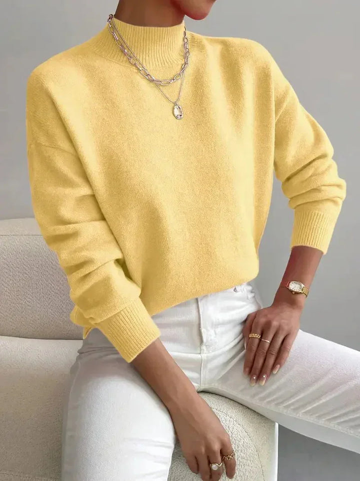 Relaxed fit women's mock turtleneck long sleeve sweater, a stylish & comfortable layering top for cold weather.