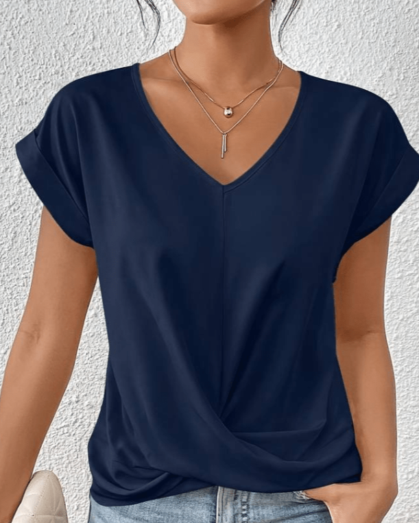 Stylish women's V-neck short sleeve top with a unique twist hem, ideal for summer and versatile fashion.