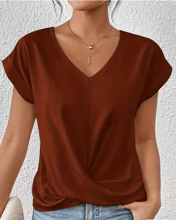 Casual women's short sleeve V-neck top with a stylish twist hem, designed for comfort and everyday flair.