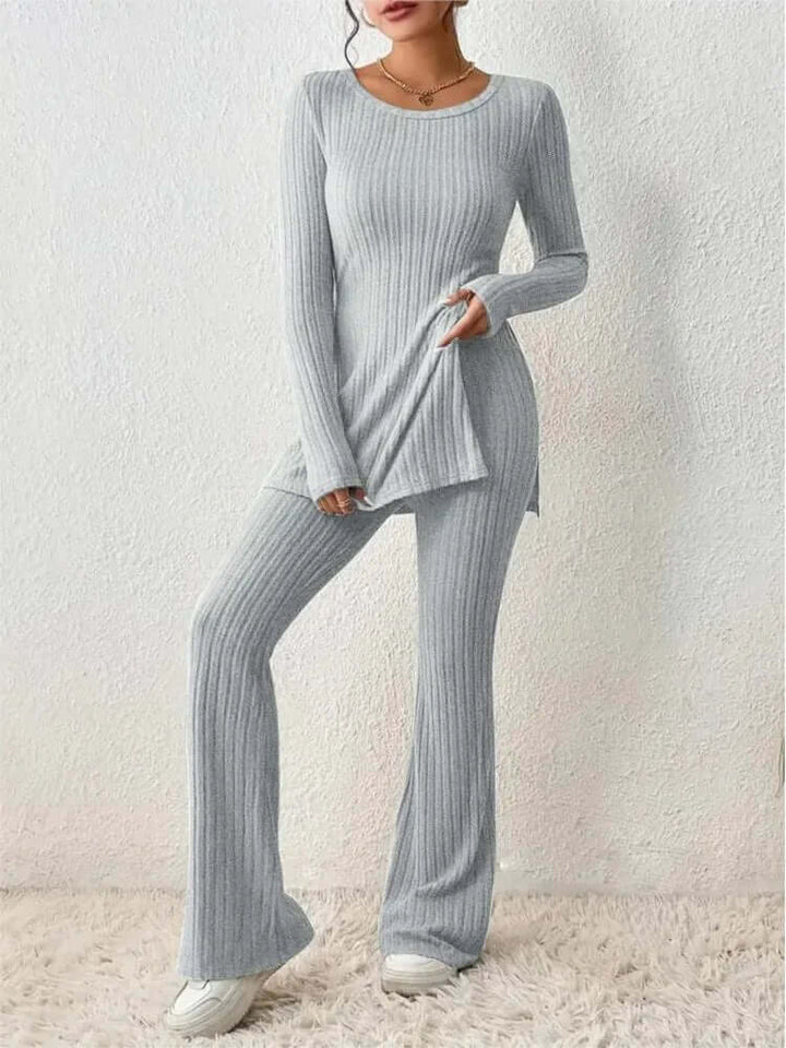 Fashionable women's two-piece set; elegant long-sleeve top paired with flowy flared lounge trousers.