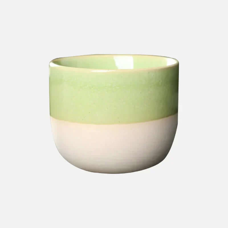 Modern ColorSplash ceramic coffee mug with vibrant hues, perfect for adding a pop of color to your kitchen.