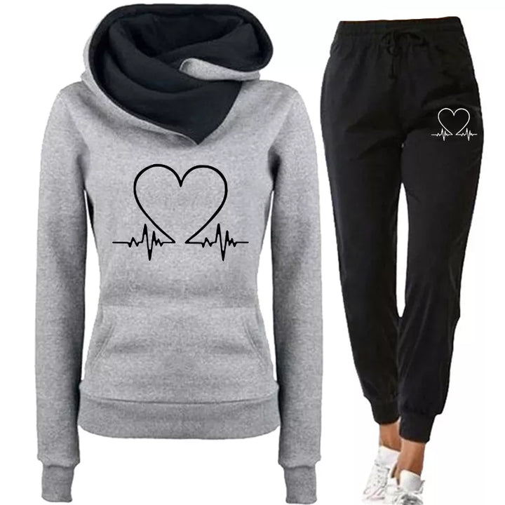 Modern women's active wear set: WARMFLEX hoodie & pants. Comfortable outfit for any occasion.