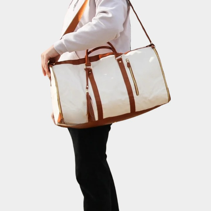 Durable vegan leather wrinkle-free duffel & garment bag. Unisex design for secure business travel.