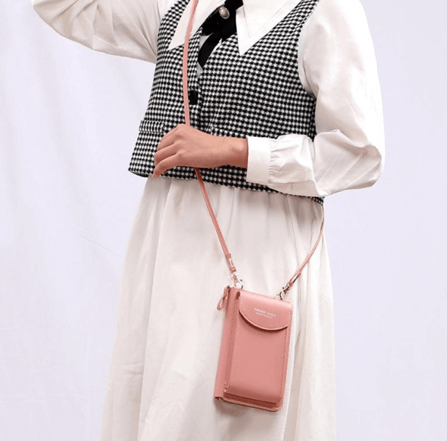 Everyday women's small PU leather shoulder bag, shown with ample space for phone and wallet.