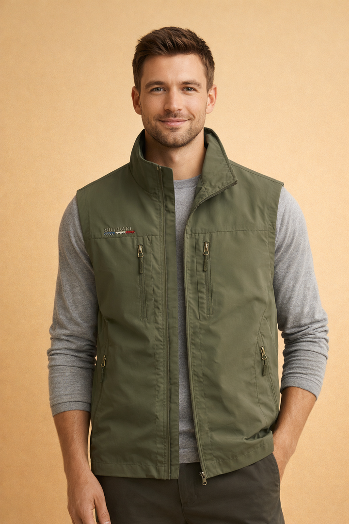 Travel-ready men's utility vest, multi-zip pockets for secure storage. Durable sleeveless jacket for outdoor exploration.