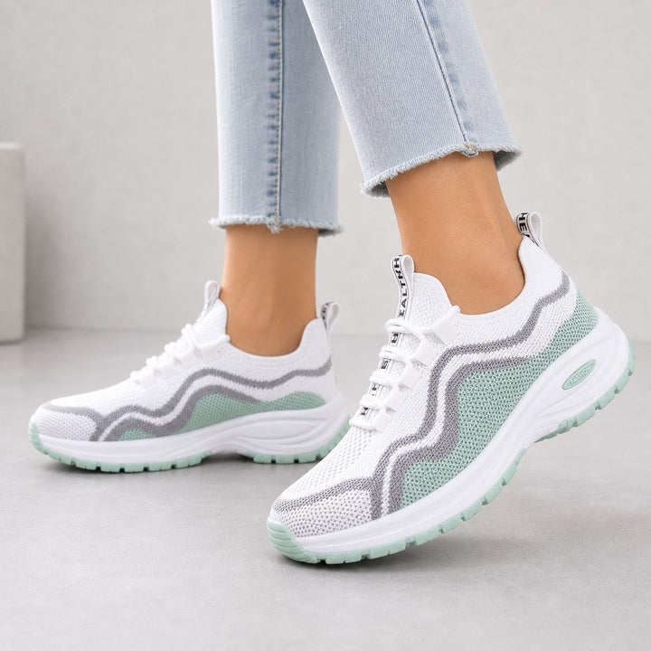 Side view of Cora women's athletic walking shoes, emphasizing flexible sole.