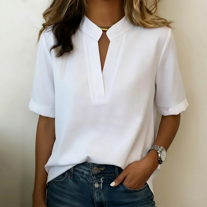 Women's V-neck short sleeve blouse, relaxed fit. Perfect versatile top for casual wear or office.