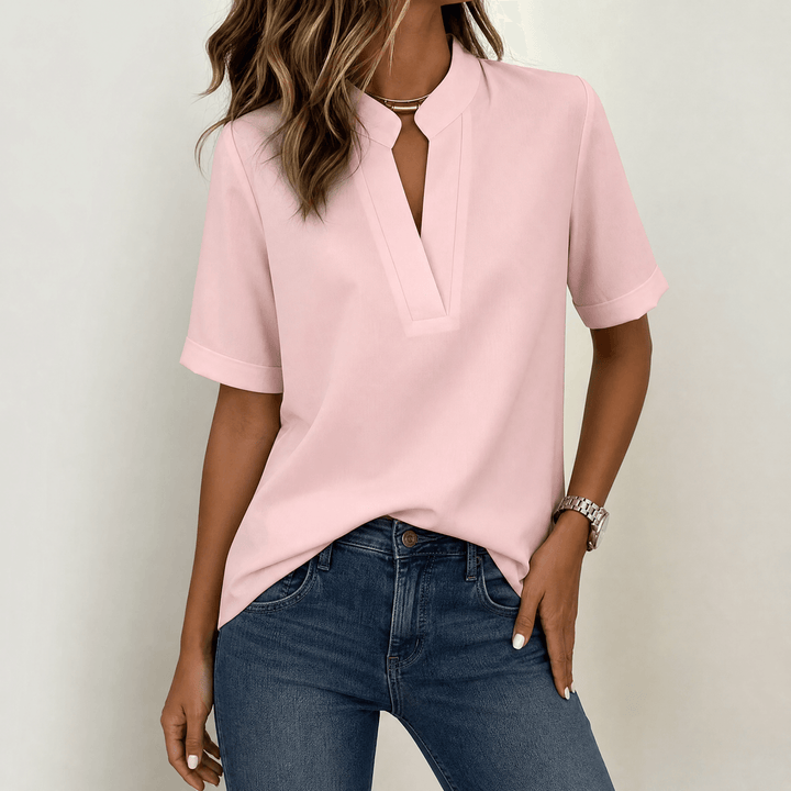 Chic women's V-neck short sleeve blouse. Smart office wear top or dressed-up casual outfit essential.