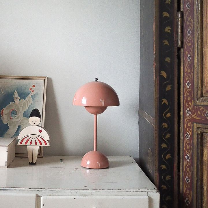 Vintage-inspired LED umbrella table lamp, portable and battery-operated for versatile ambient lighting.