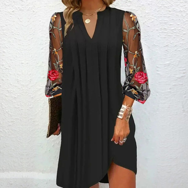 Elegant women's black floral formal dress with sheer sleeves, perfect for evening parties & special occasions.