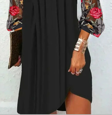 Sophisticated women's black floral evening dress with elegant sheer sleeves. Perfect for formal events.