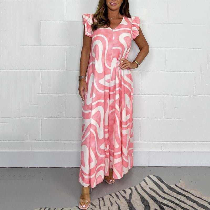 Detail of the flutter sleeves on an elegant women's abstract print wide-leg maxi jumpsuit, perfect for any occasion.
