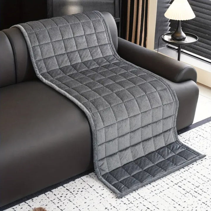 Elegant quilted sofa protector & slipcover, non-slip microfibre for complete furniture shield.