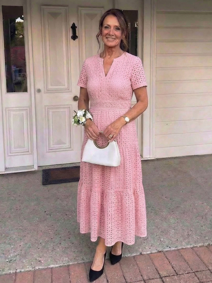 Effortless women's pink tiered midi dress. Comfortable, casual summer fashion.