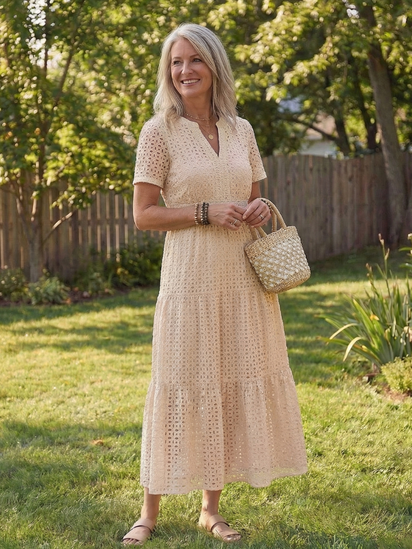 Casual women's pink tiered midi dress. Elegant summer style, comfortable fit.