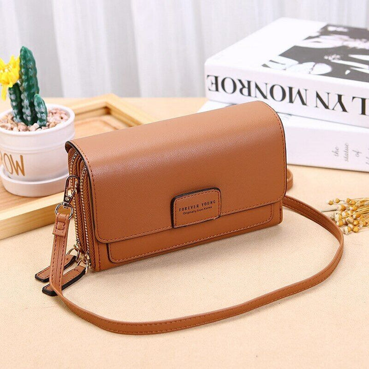 PU leather women's shoulder bag with multiple compartments, an organizer wallet.
