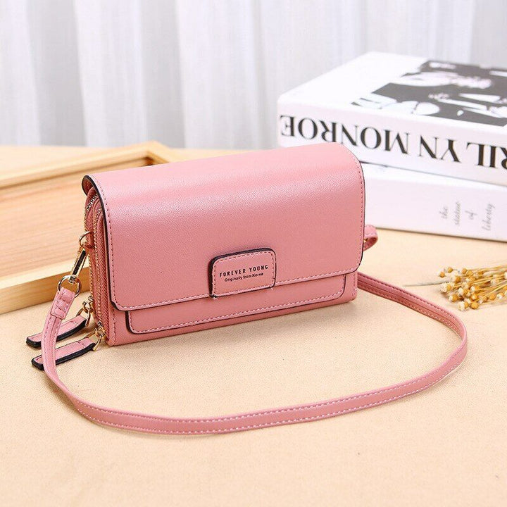 Durable PU leather women's everyday bag, functioning as a stylish wallet.