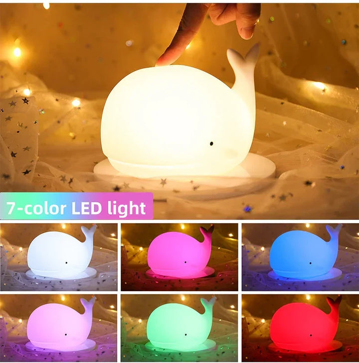 Soft silicone whale night light, ideal nursery decor. Gentle, safe glow for toddler's room & peaceful sleep.