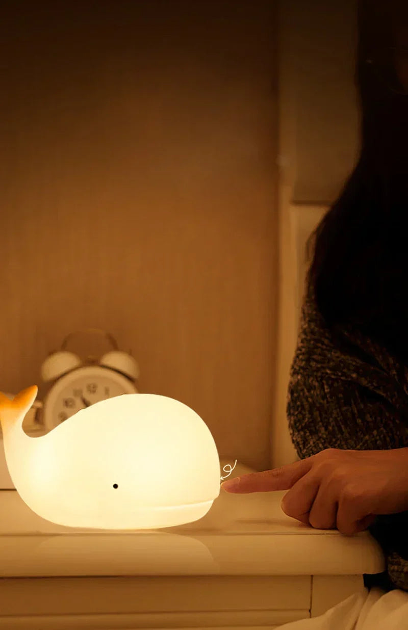 Child-safe whale night light, a charming bedside lamp with gentle, color-changing glow for kids' rooms.