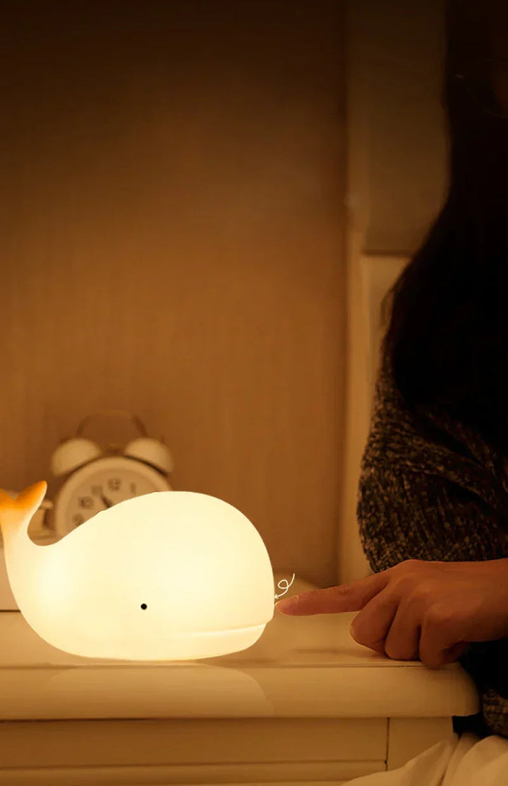 Child-safe whale night light, a charming bedside lamp with gentle, color-changing glow for kids' rooms.