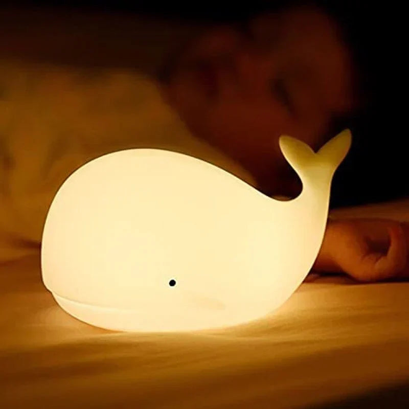 Playful whale-shaped kids lamp creating a relaxing, color-changing glow. Great for any children's room & nursery.