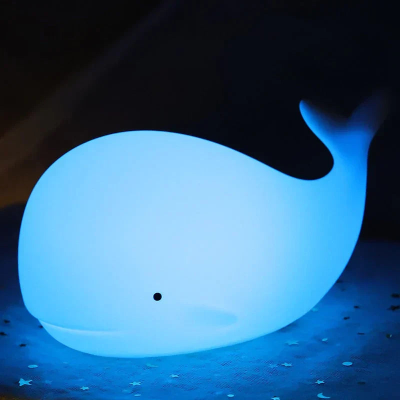 Durable silicone whale night light for kids. Safe, soft-touch design with a magical color-changing glow.