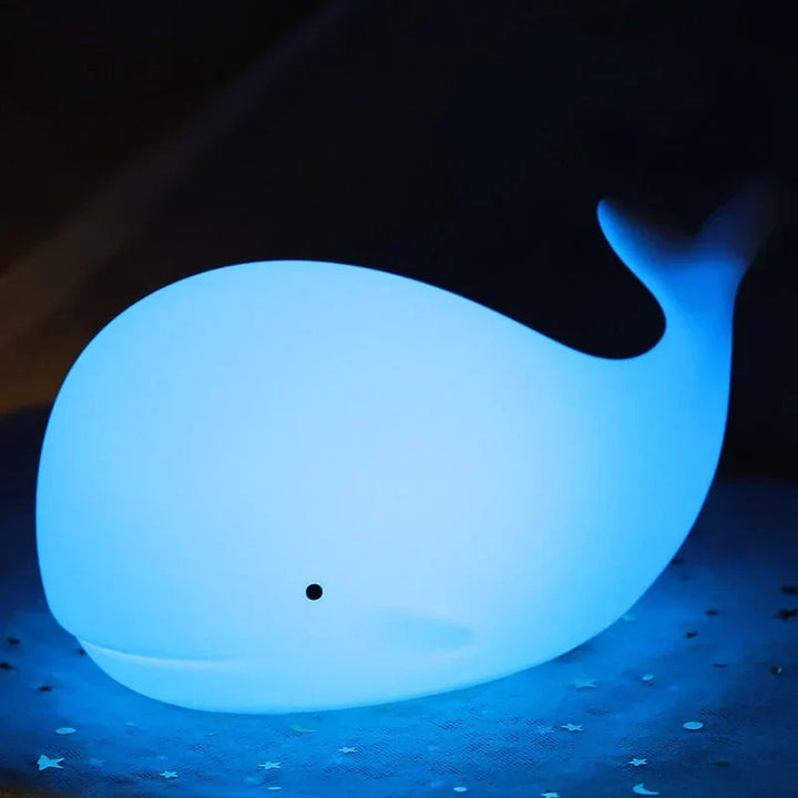 Durable silicone whale night light for kids. Safe, soft-touch design with a magical color-changing glow.