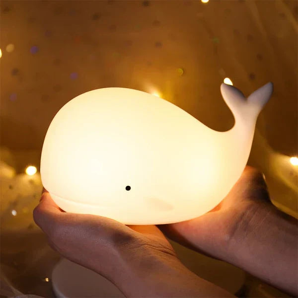 Soothing color-changing whale night light. This charming kids lamp adds a gentle glow to any children's room.